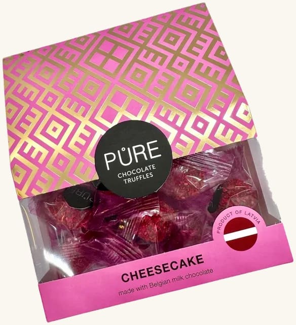 Melkesjokoladetrøfler med ostekake-smakskrem og bringebærdekor PURE 96g